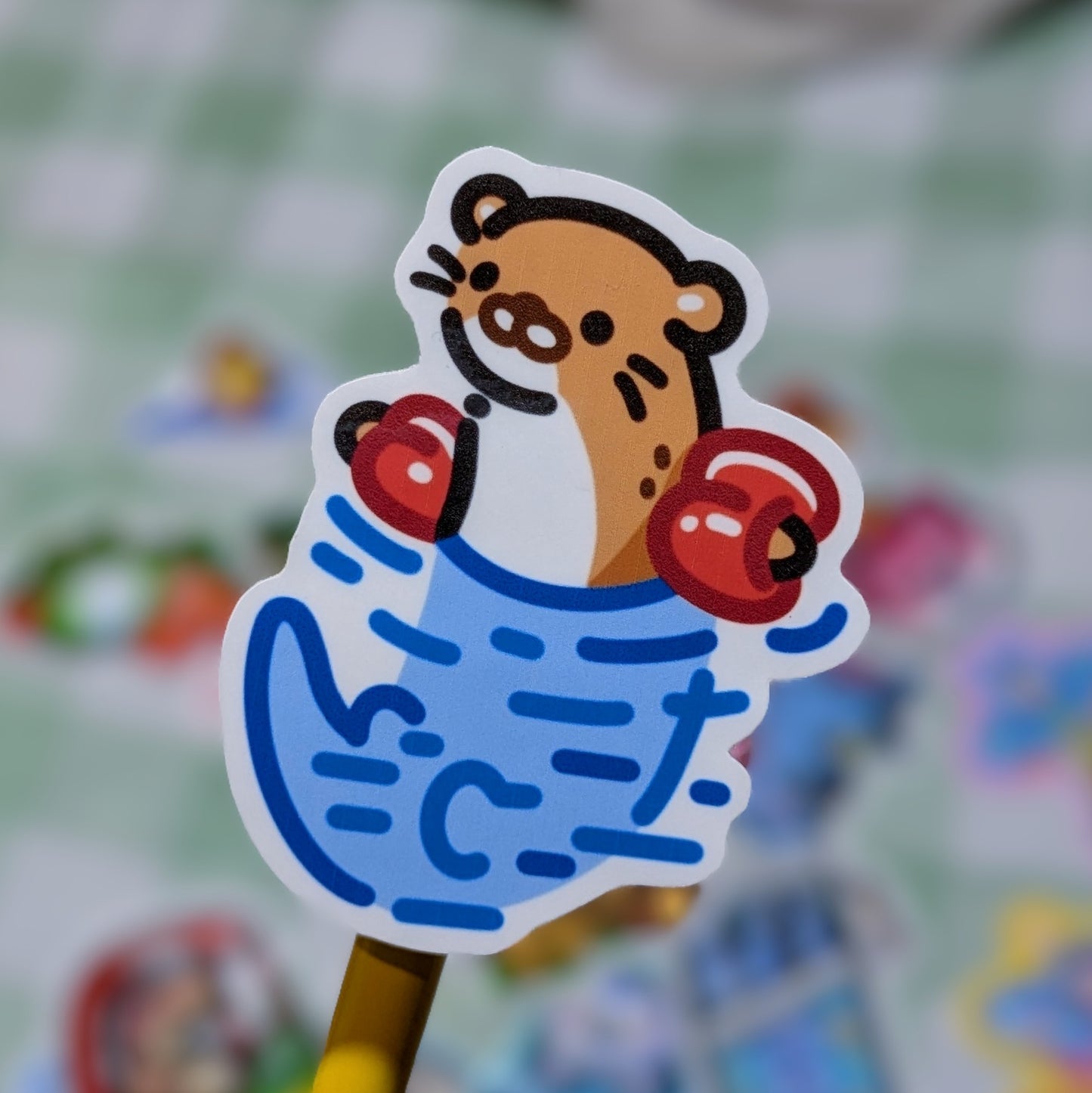 Floating otter sticker